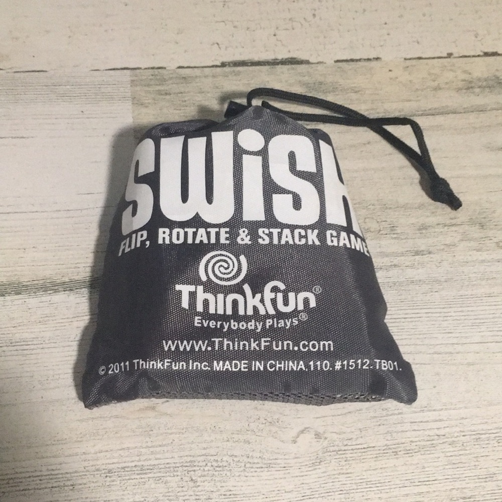 Swish Flip, Rotate, & Stack Game Card game with closeable pouch.